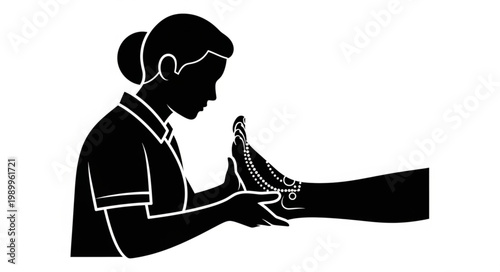 Medical professional examining a patients foot in silhouette.