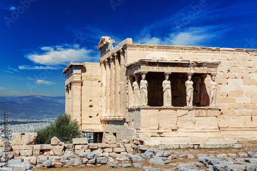 Ancient Erechtheion or Erechtheum temple with Caryatid Porch on the Acropolis, Athens, Greece. World famous landmark at the Acropolis Hill.