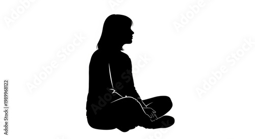 Silhouette of a person sitting cross legged.