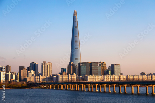 Seoul city skyline with Han River, Skyscrapers and Lotte tower during sunset