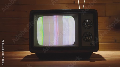 Turning on Old Vintage 80's Television with Static and Color Bars on Screen