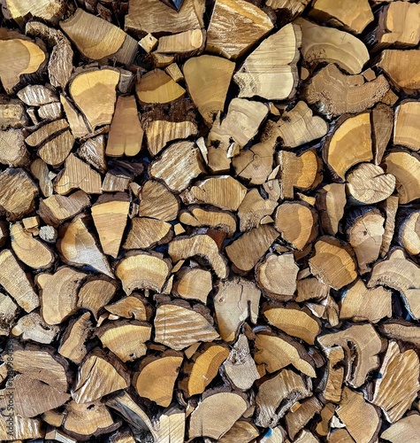 Wallpaper Mural Close-up of stacked firewood showing cut log ends and natural wood grain, highlighting rustic texture, tree rings Torontodigital.ca