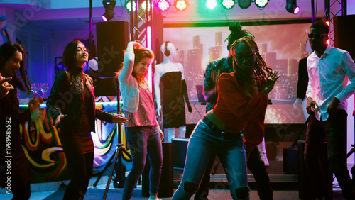 Tableau sur toile Funky people partying on dance floor enjoying electronic music party at nightclub