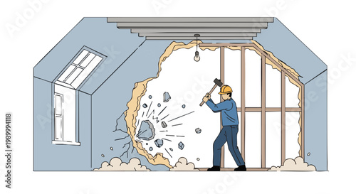 Builder demolishing wall with sledgehammer in attic renovation
