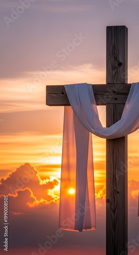 Wooden Christian Cross with White Cloth Shroud at Sunset Sky.
