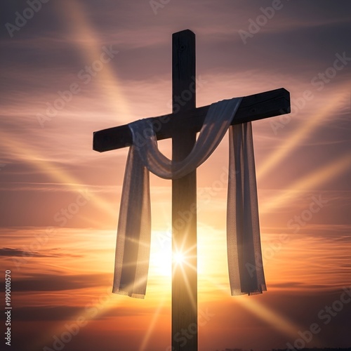Wooden cross with white cloth at sunset with sun rays.