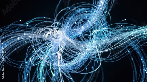 Abstract blue fiber optic cables with glowing lights and dark background.