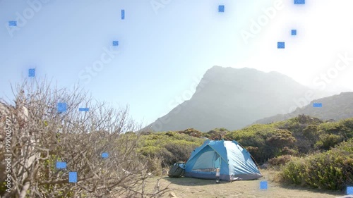 Overlay starting, reappearing blue square particles drifting over blue tent, indicating artifact