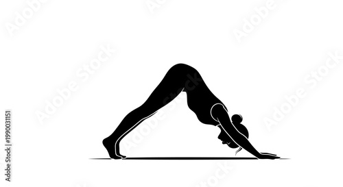 Silhouette of a woman doing a downward facing dog yoga pose.