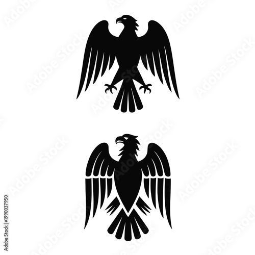 Two black eagle silhouettes with spread wings