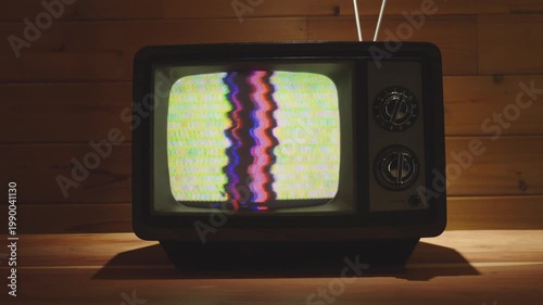 Vintage Television in living room with wooden background. 
