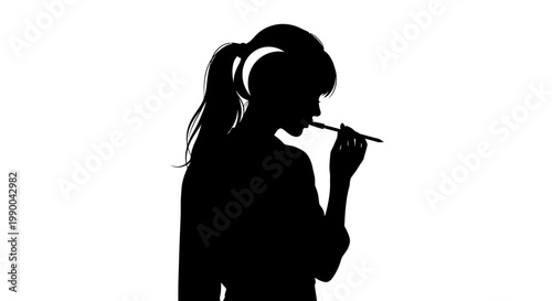 Silhouette of female artist with ponytail holding a paintbrush