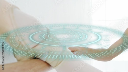 Assistant holding beige pad while holo ring appearing, adjusting recipient chest for medical exam