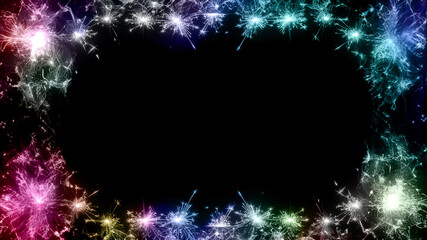 Colorful sparkler fireworks frame on black background with copy space, festive celebration border design