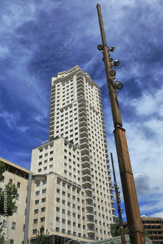 Modern High-Rise Building with Dramatic Sky in Madrid
