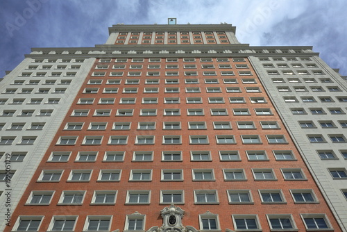 Symmetrical High-Rise Building Facade with Repetitive Windows in Madrid