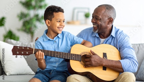 Grandfather and Grandson Play Guitar Together