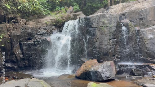 Crystal-clear waterfall cascades through the lush Western Ghats in stunning 4K, surrounded by misty cliffs, vibrant greenery, and the raw beauty of monsoon wilderness.