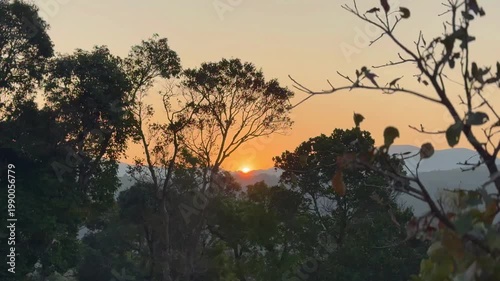 A golden sunrise unfolds over the Western Ghats of India as clouds drift and hills awaken in a stunning time-lapse of light, mist, and nature’s timeless morning magic.
