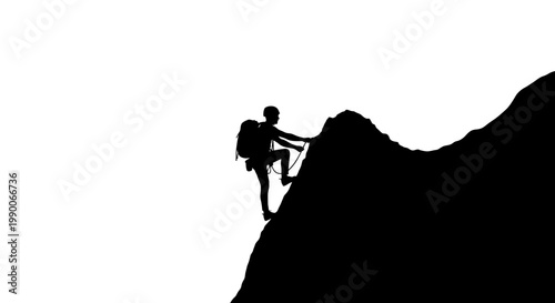 Silhouette of a mountain climber ascending a steep rock face