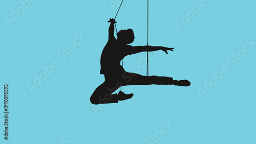 Dynamic silhouette of an aerial dancer suspended by ropes, showcasing impressive agility and acrobatic skill against a blue background.