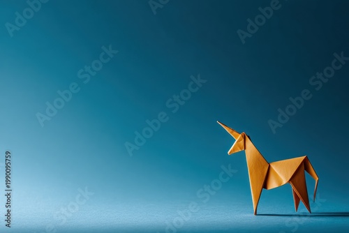 Orange paper unicorn stands against a deep blue background.