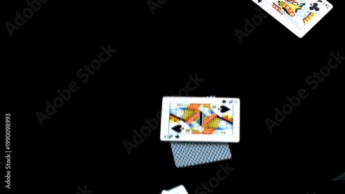 Falling Playing Cards Scattered on Black Background