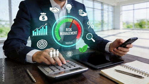 Businessman using digital tablet and calculator analyzing risk management metrics in modern office holographic interface showing financial growth charts percentage indicators