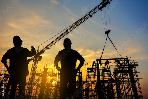 фотографія silhouette construction worker Concrete pouring during commercial concreting flo