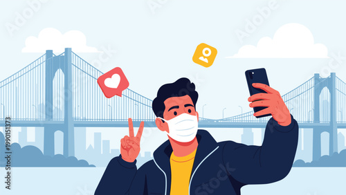 Young man wearing a protective face mask taking a selfie with a smartphone in front of a large suspension bridge and distant city skyline.