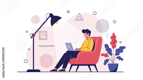 Relaxed man sits in a large red armchair while working on his laptop under the warm light of a tall floor lamp.