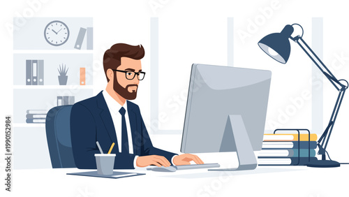 Successful professional man in a business suit works intently at his desk in a modern well lit corporate office.