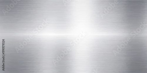 A polished silver stainless steel plate features a brushed metal texture with a grey industrial pattern and light reflections on a shiny metallic surface backdrop