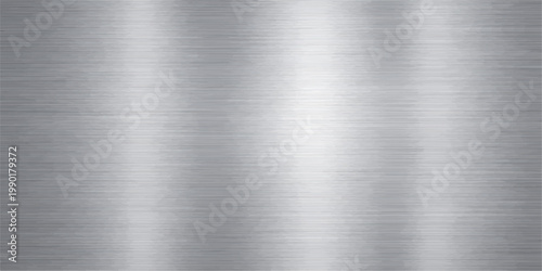 Polished industrial stainless steel plate with a shiny brushed metal texture on a gray metallic silver aluminum surface material