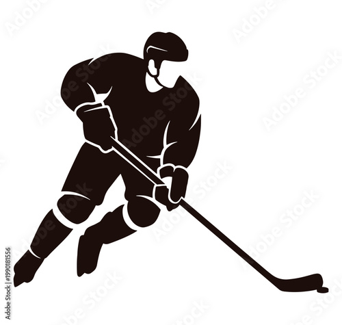 Ice hockey player in action with stick on ice rink