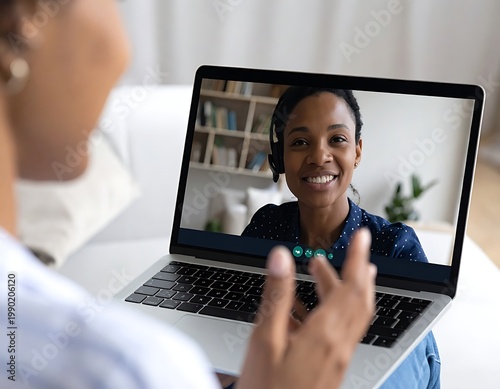 Woman engaging in video call on laptop