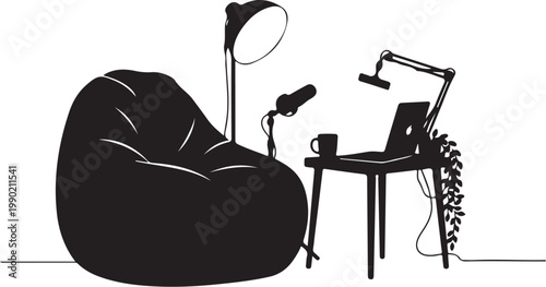 Black and white of home office workspace with bean bag laptop