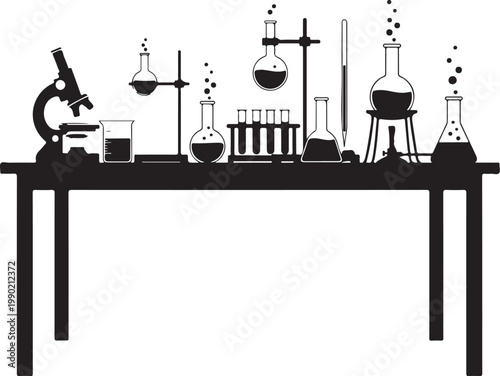 Laboratory equipment on a table microscope beakers