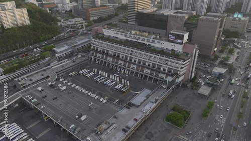 Aerial view of Seoul Express Bus Terminal at sunset with heavy traffic and city lights, Gangnam, South Korea.