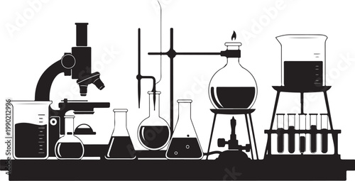 Laboratory equipment on a table microscope beakers