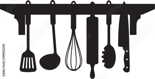 Kitchen utensils hanging on rack spatula