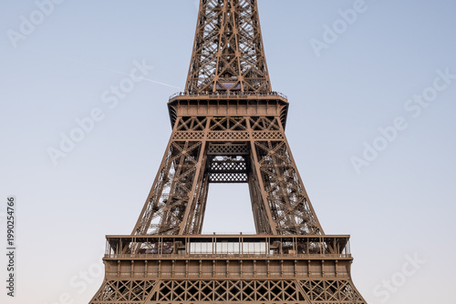 Paris, France – Detailed view of Eiffel Tower's iron lattice structure, built for 1889 World's Fair, masterpiece of 19th-century engineering and symbol of France.