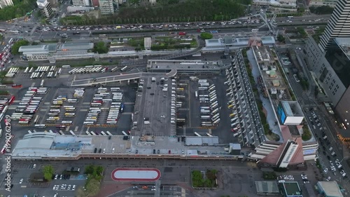 Aerial view of Seoul Express Bus Terminal at sunset with heavy traffic and city lights, Gangnam, South Korea.