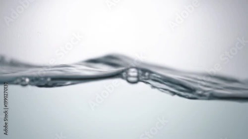 Cinematic Slow Motion Video of Clean Clear Water Waves and Ripples Against a Bright White Background