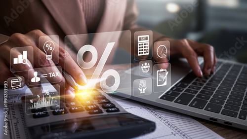 Fotografie Businesswoman calculating annual taxes and paying taxes