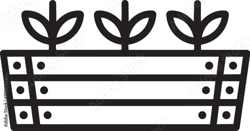 A black and white image of a wooden planter box with three plants growing out of it