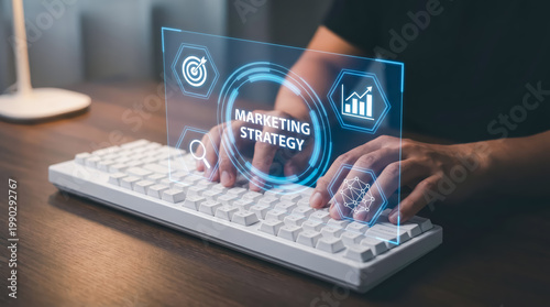 Marketing strategy concept with digital interface and business icons on a computer keyboard