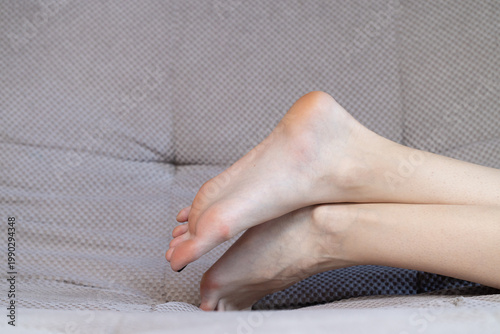 Relaxing with feet up on a comfortable sofa, promoting well-being and a calm lifestyle