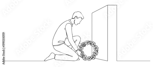 Man kneeling at a memorial monument. Continuous line art illustration of remembrance and honor. Victory day tribute