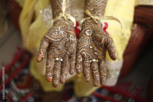 woman in mehendi hands an indian tatoo